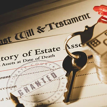 Estate planning documents including a Last Will and Testament with a key and coins